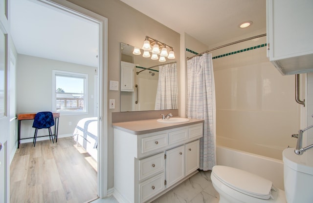 full bathroom with shower / bath combo, vanity, and toilet