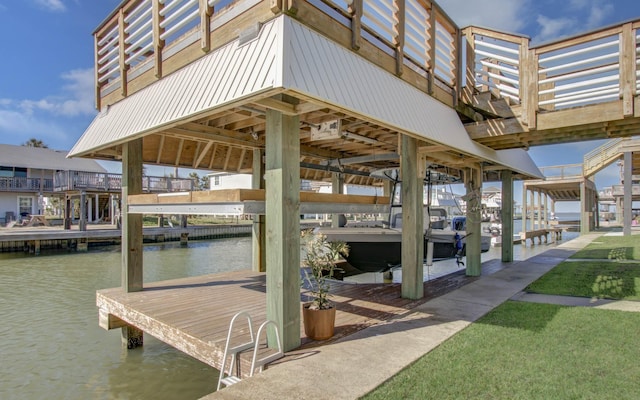 view of dock featuring boat lift and a water view