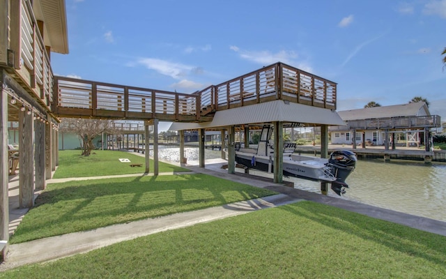 dock area with a lawn, a water view, and boat lift