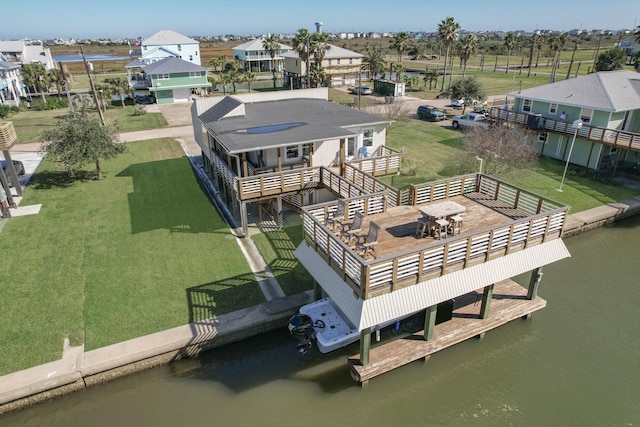 bird's eye view featuring a residential view and a water view