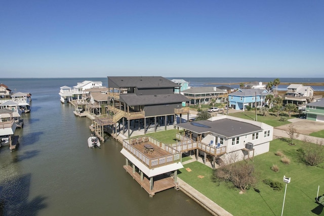 bird's eye view featuring a water view and a residential view