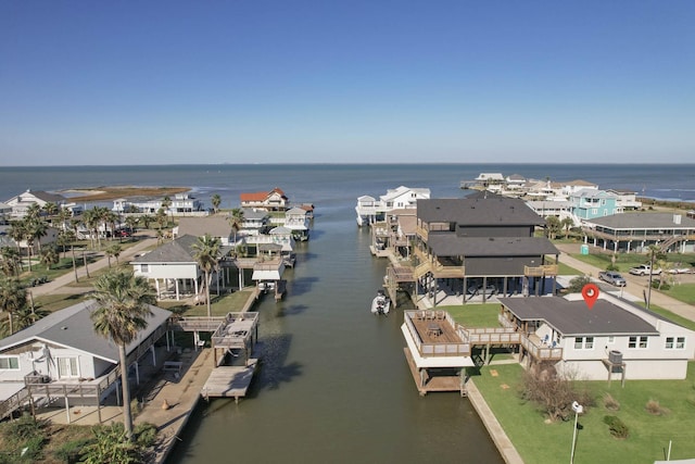 birds eye view of property with a residential view and a water view