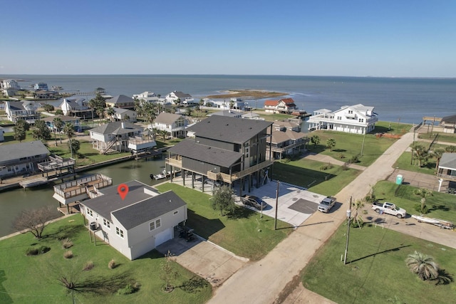 bird's eye view featuring a residential view and a water view