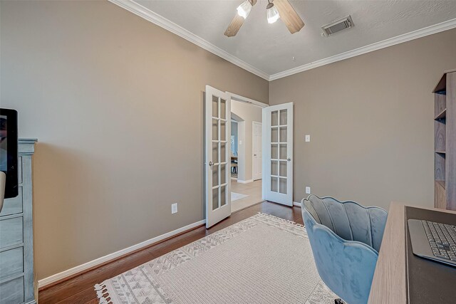 office area featuring hardwood / wood-style flooring, ceiling fan, french doors, and ornamental molding