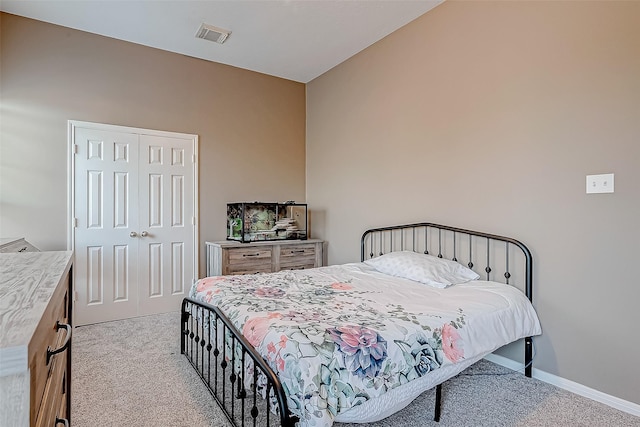 carpeted bedroom with a closet