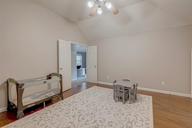 sitting room featuring lofted ceiling, ceiling fan, and wood-type flooring