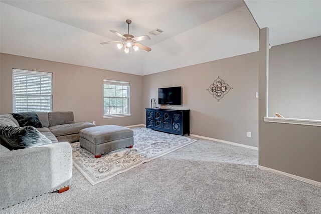 carpeted living room featuring lofted ceiling and ceiling fan