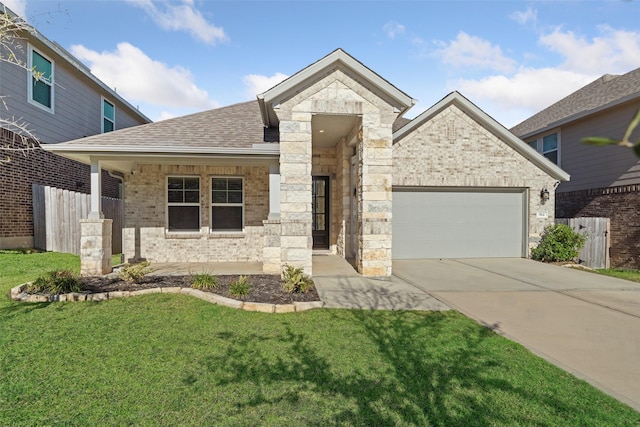 view of front facade featuring a garage and a front lawn