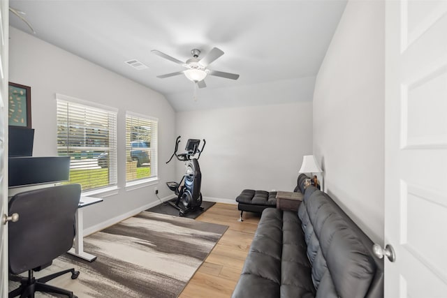 office area featuring ceiling fan, wood-type flooring, and vaulted ceiling