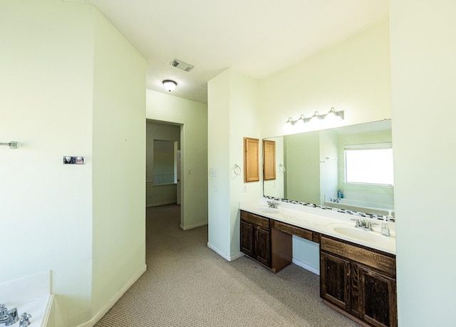 bathroom featuring a bathing tub and vanity