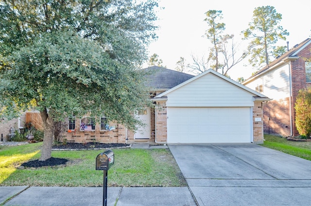 view of front of house featuring a garage and a front yard