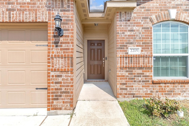 view of exterior entry featuring a garage