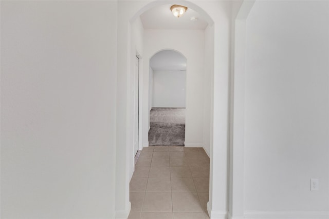 hallway with light tile patterned floors