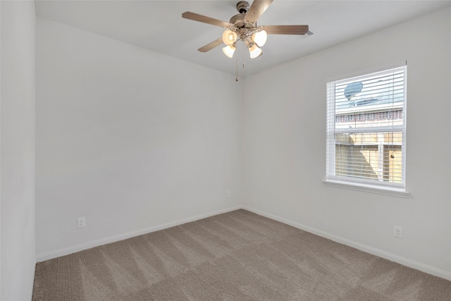 empty room with carpet and ceiling fan