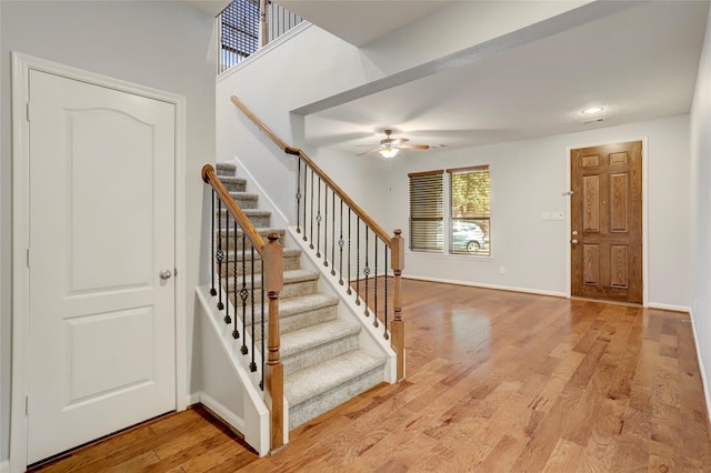 foyer entrance featuring ceiling fan and light hardwood / wood-style floors