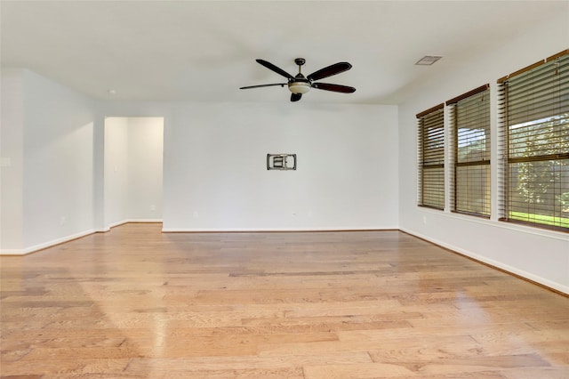 unfurnished room featuring light hardwood / wood-style flooring and ceiling fan