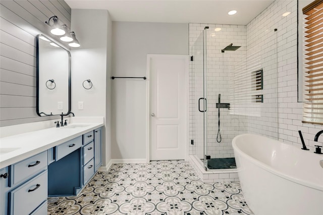 bathroom featuring tile patterned flooring, vanity, and independent shower and bath