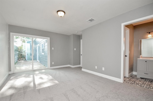 empty room featuring light carpet