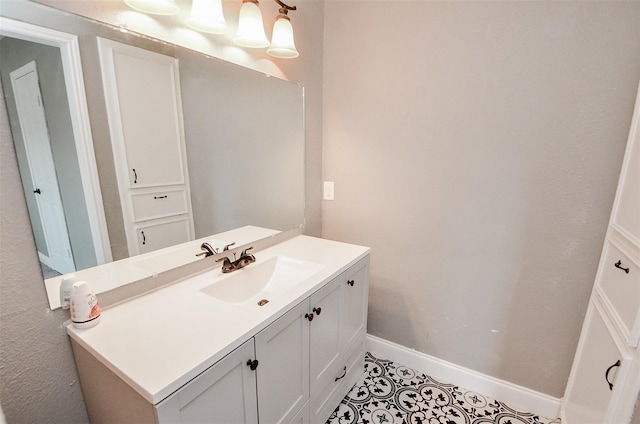 bathroom with tile patterned flooring and vanity