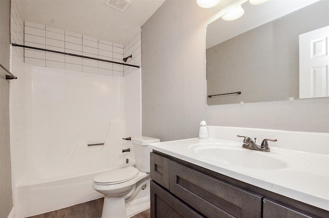 full bathroom featuring wood-type flooring, vanity, toilet, and shower / washtub combination