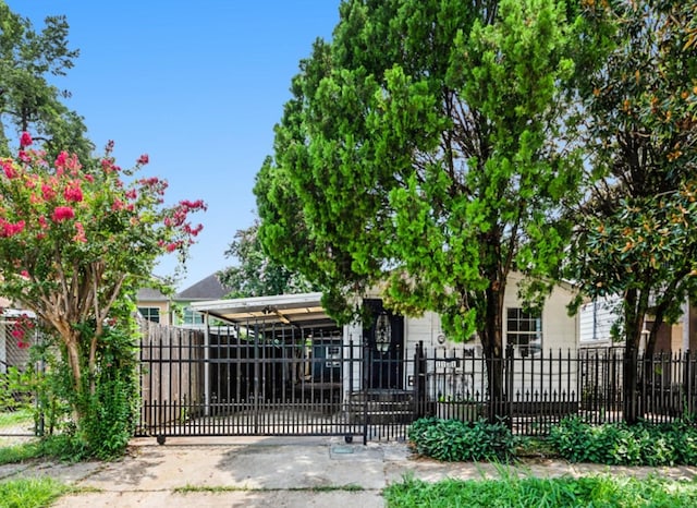 view of gate featuring a carport