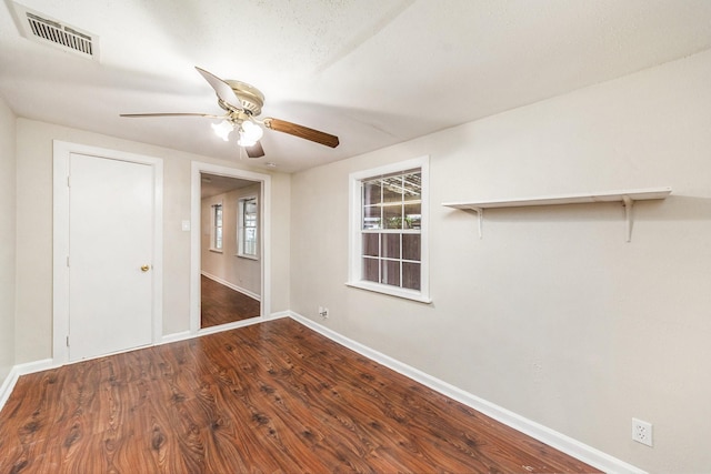 unfurnished room featuring hardwood / wood-style floors and ceiling fan