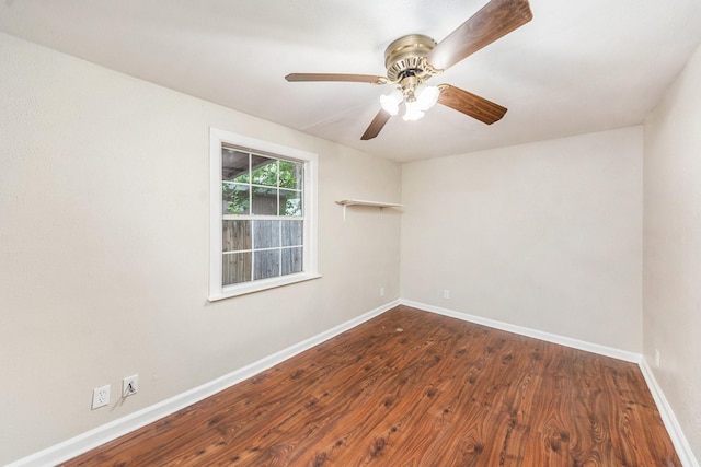 spare room with ceiling fan and dark hardwood / wood-style flooring