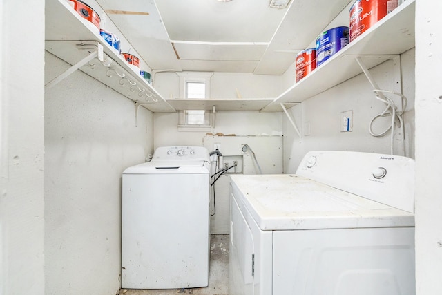 laundry area featuring washing machine and clothes dryer