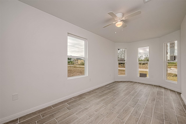 unfurnished room featuring ceiling fan and light wood-type flooring