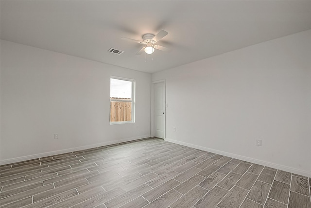 unfurnished room with ceiling fan