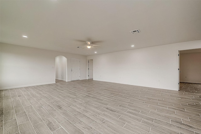 unfurnished room featuring ceiling fan and light hardwood / wood-style flooring