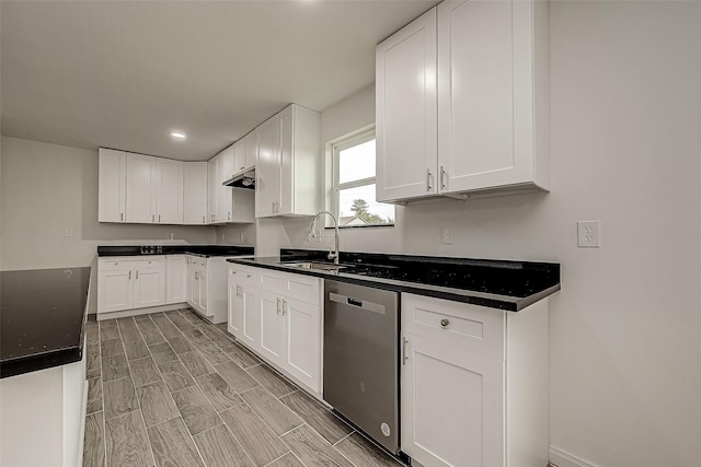 kitchen with white cabinets, stainless steel dishwasher, and sink