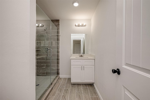 bathroom with vanity and walk in shower