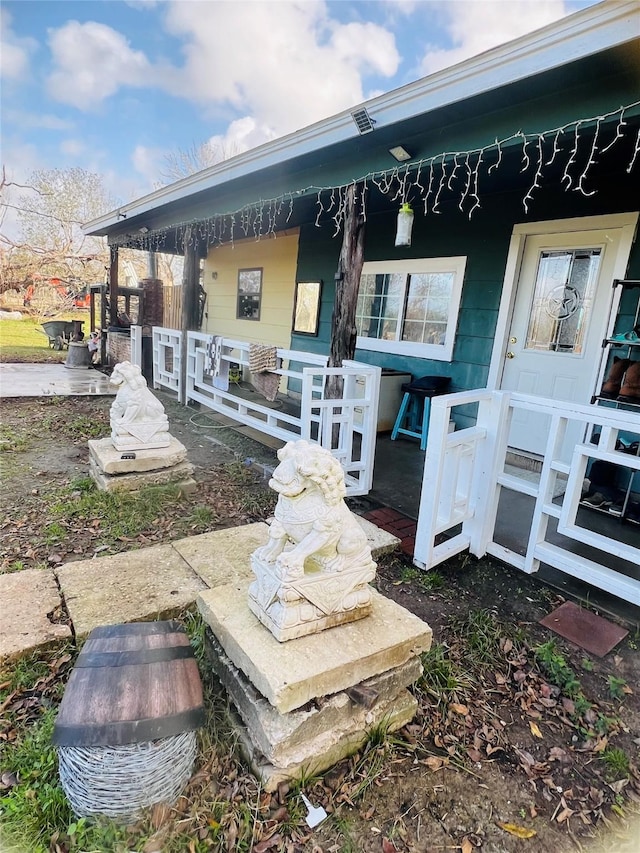 back of property featuring a porch