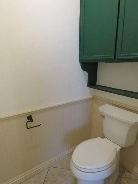 bathroom with tile patterned floors and toilet