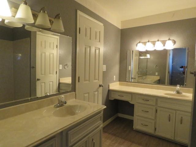 bathroom featuring hardwood / wood-style flooring and vanity