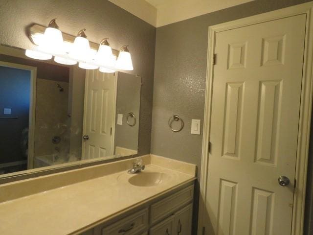 bathroom with vanity and walk in shower