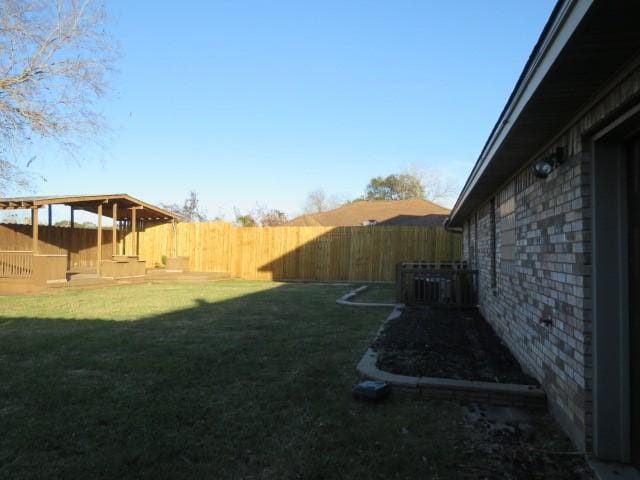 view of yard with central AC unit