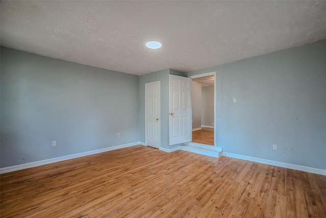 unfurnished bedroom with light hardwood / wood-style flooring