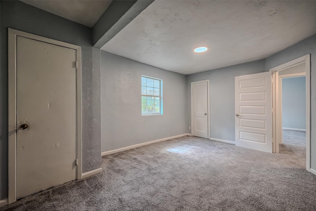 unfurnished bedroom with carpet flooring