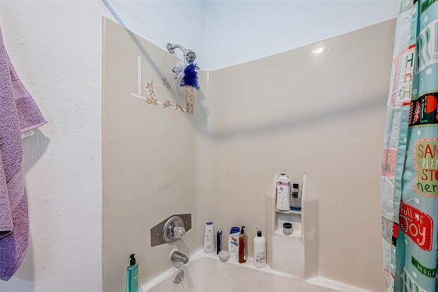 bathroom featuring shower / bath combo with shower curtain