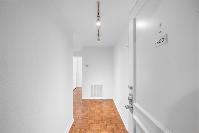 hall with light parquet floors