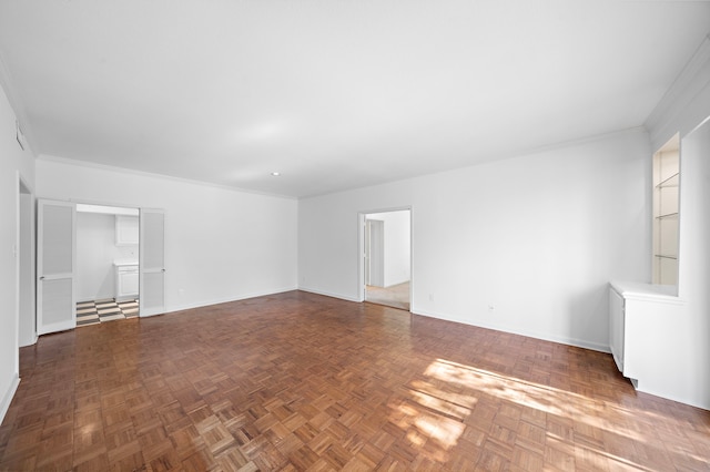 unfurnished room with dark parquet floors and ornamental molding