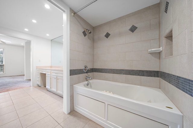 bathroom with vanity, tile patterned floors, and tiled shower / bath