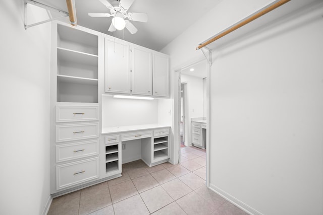 spacious closet with ceiling fan and light tile patterned floors