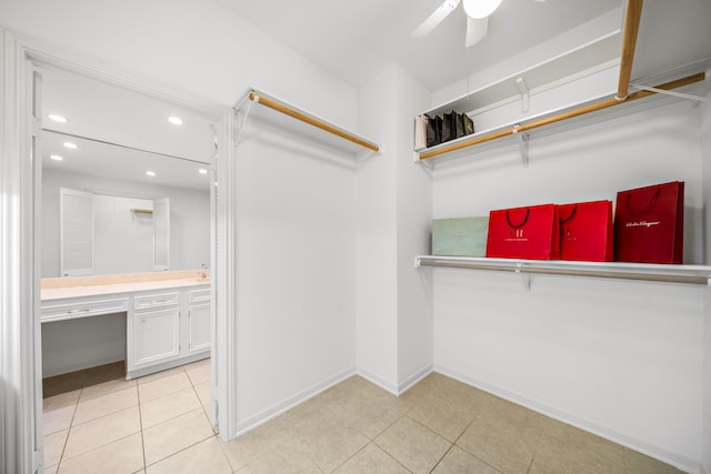 walk in closet featuring ceiling fan and light tile patterned floors