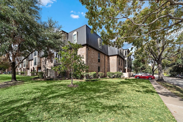 view of property exterior featuring a lawn