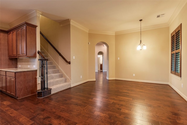 unfurnished living room with ornamental molding and dark hardwood / wood-style flooring