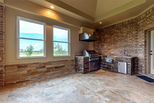 view of patio / terrace featuring exterior kitchen, a grill, and sink