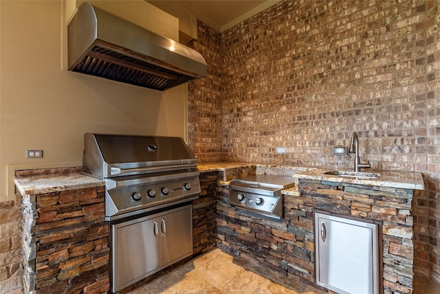 view of patio / terrace featuring grilling area, an outdoor kitchen, and sink